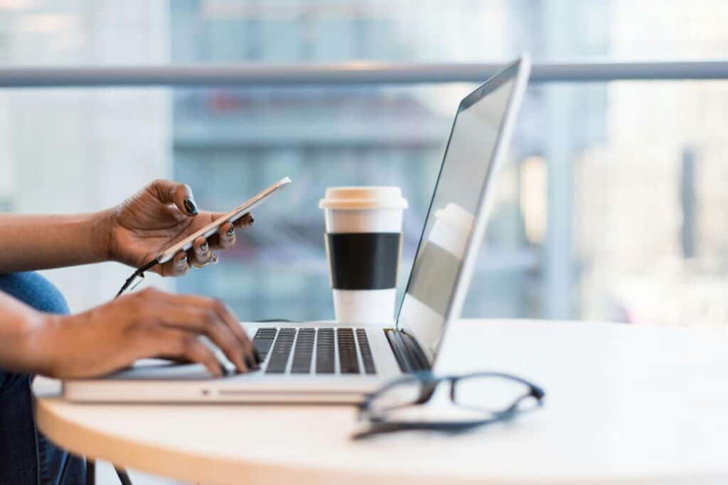 A woman is checking the insurance coverage through her laptop.