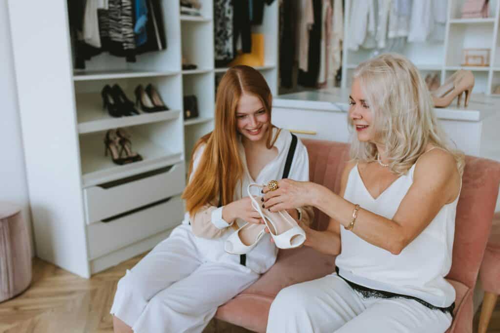 Mother and daughter shopping for shoes