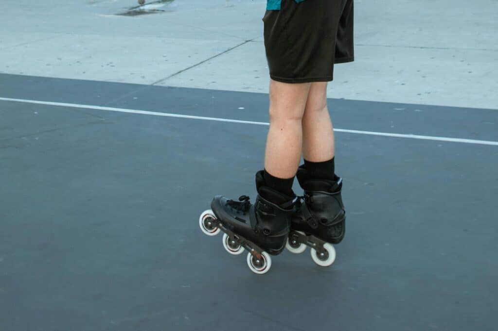 A cropped image of a teenage boy on roller blades at the park in the concept of 'top services and amenities in Wood Green'.