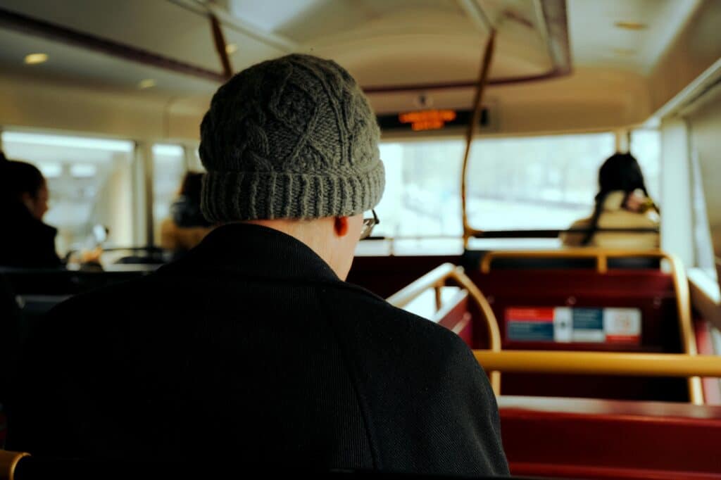 Cropped image of passengers inside a double-decker bus